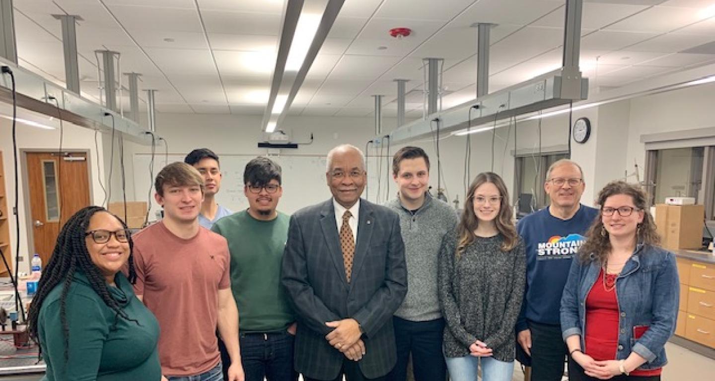 Dr. Herman B. White  with students