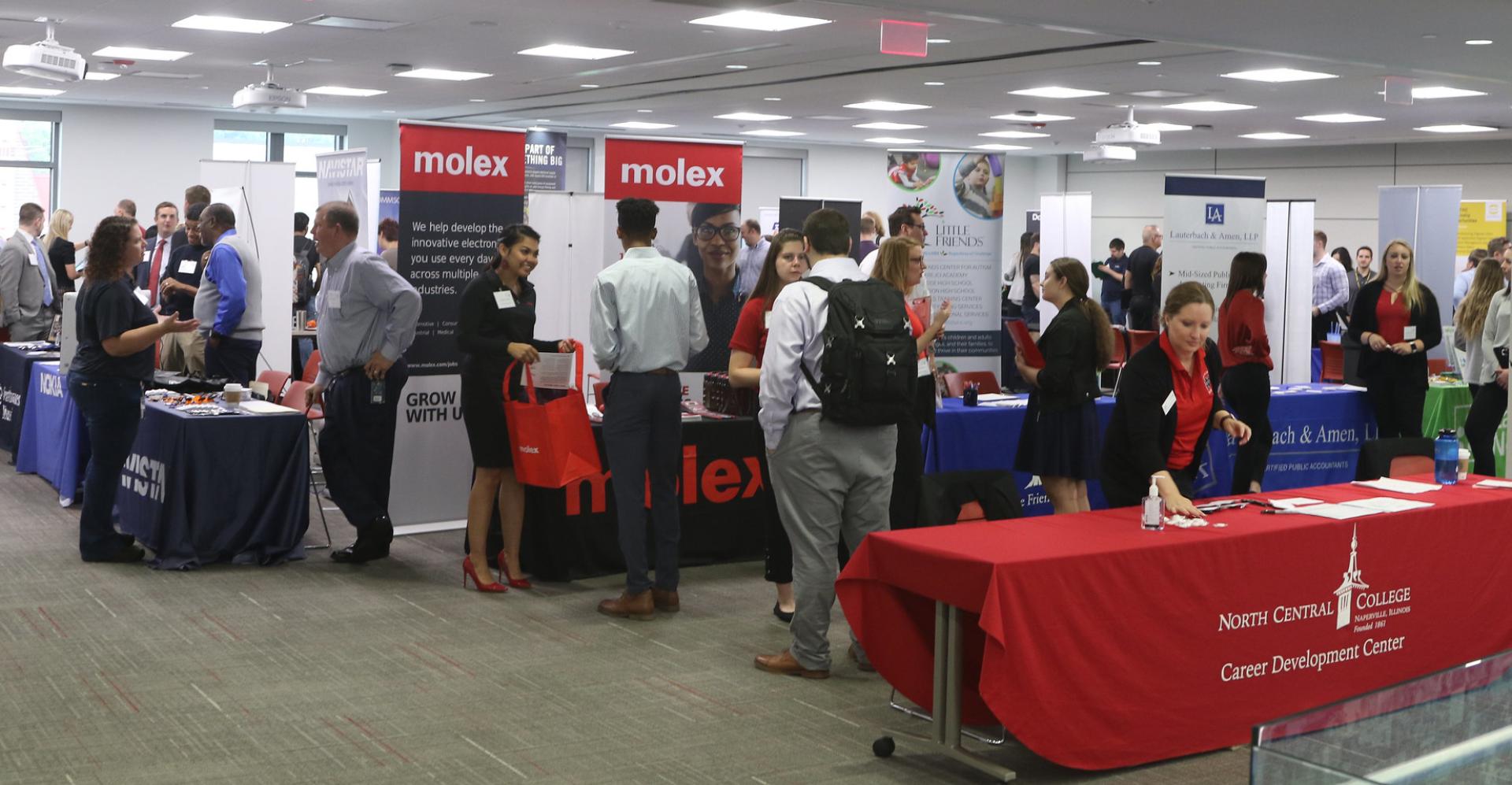 Students line up to meet companies at an event, looking for post-college careers.