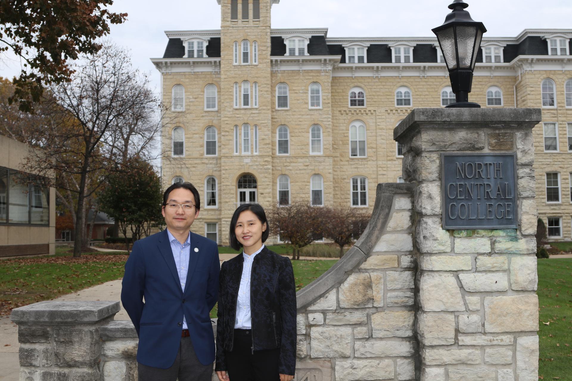 Jason Chen and Lily Chen standing in front of Old Main.