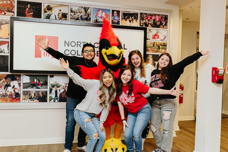 Students posing with Chippy the mascot
