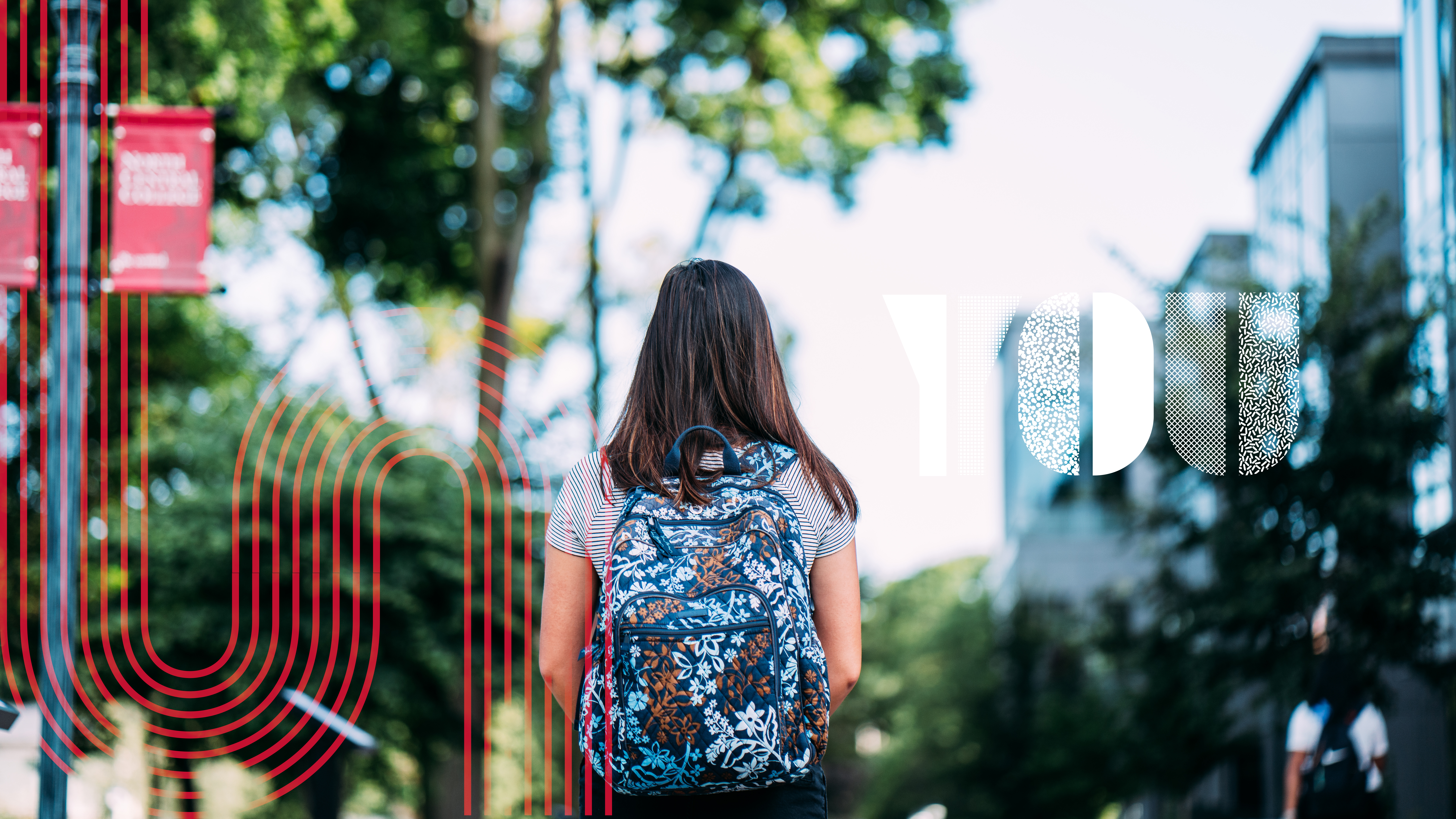 Student walking on campus path