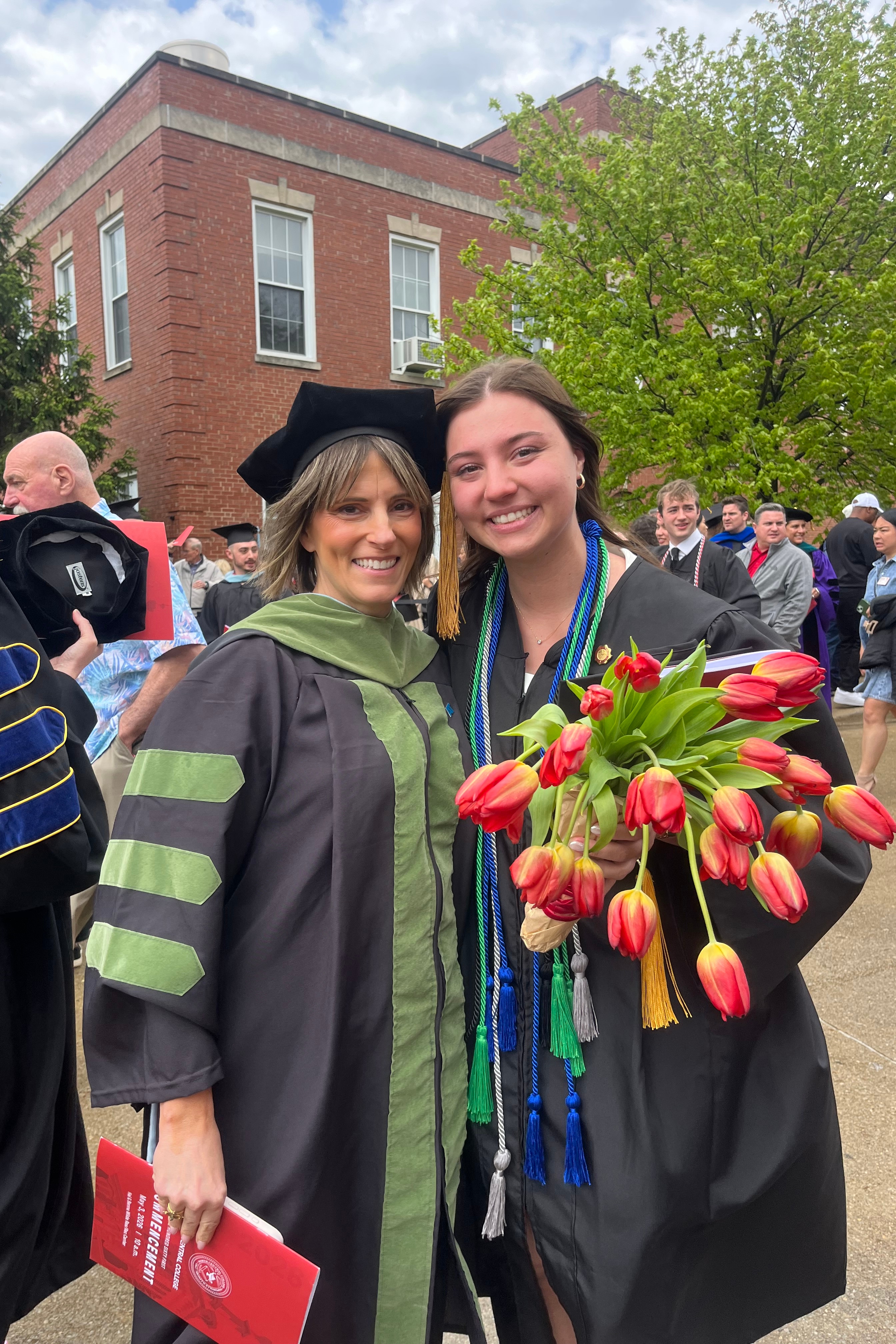 Logan and her mom Dr. Kendall Selsky are posing for a photo at Commencement.