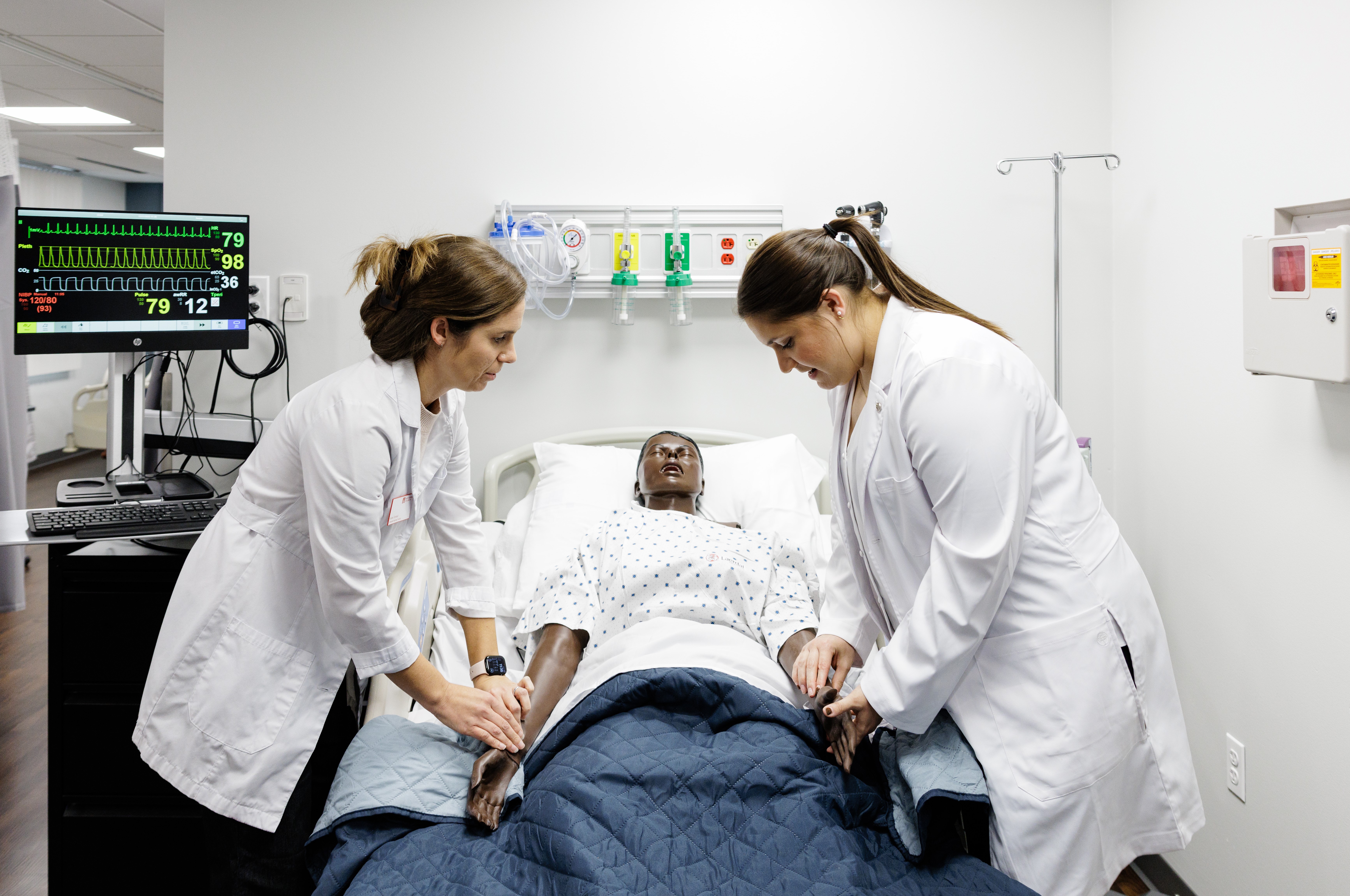 Nursing professor and student practicing in North Central College's Nursing Skills Lab