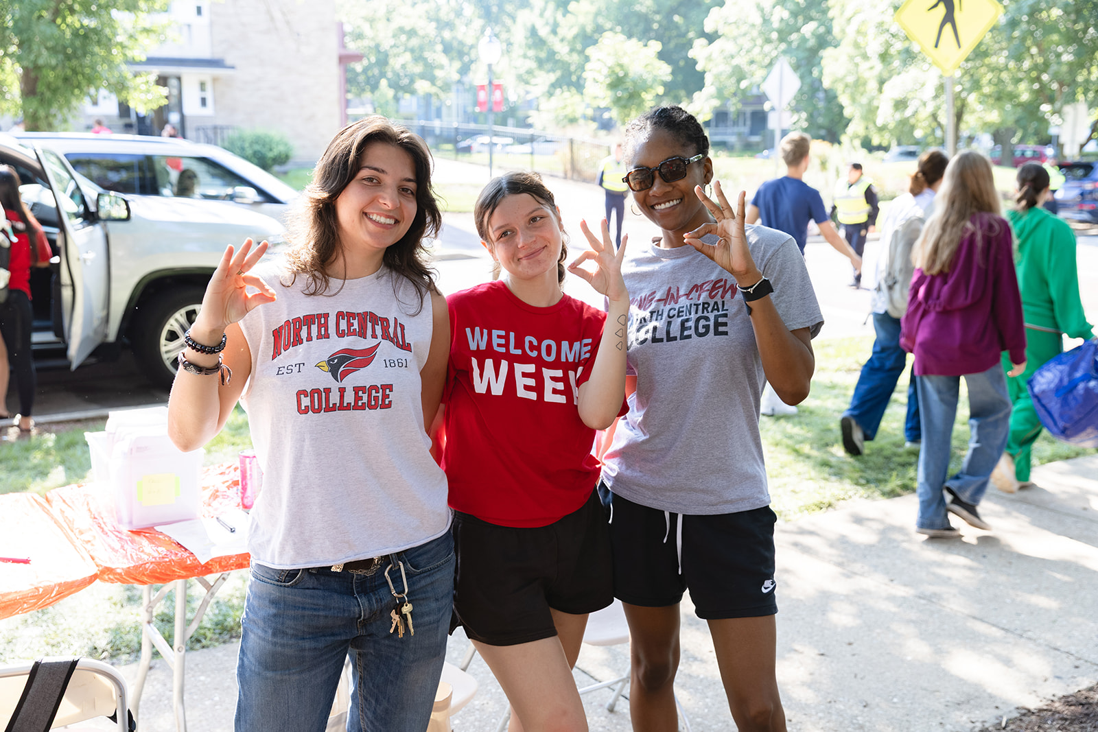 three students on move-in day