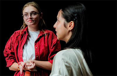 Riley Wodka (left) rehearsing "pool (no water)."