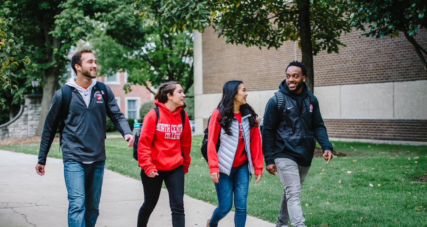 students walking on campus in fall
