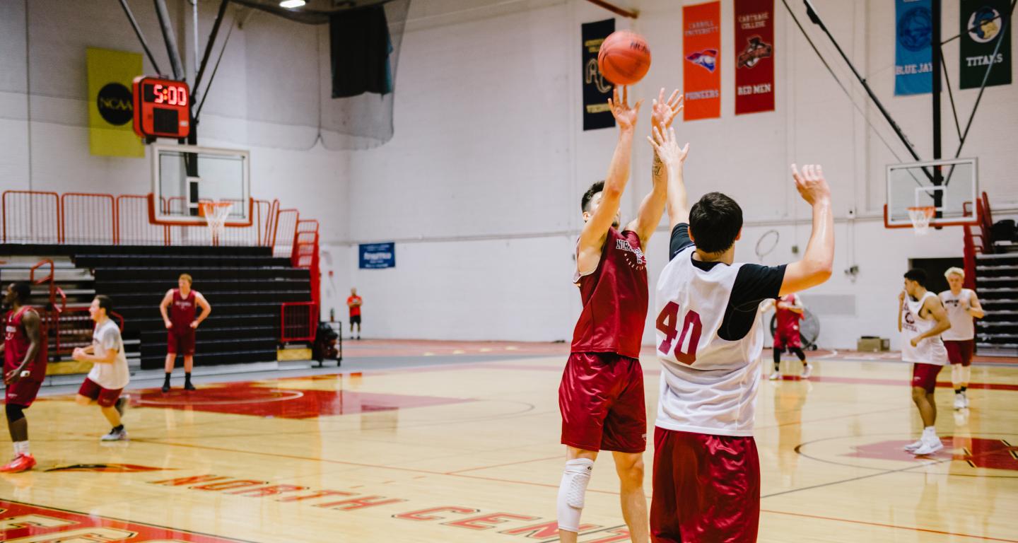 students playing basketball