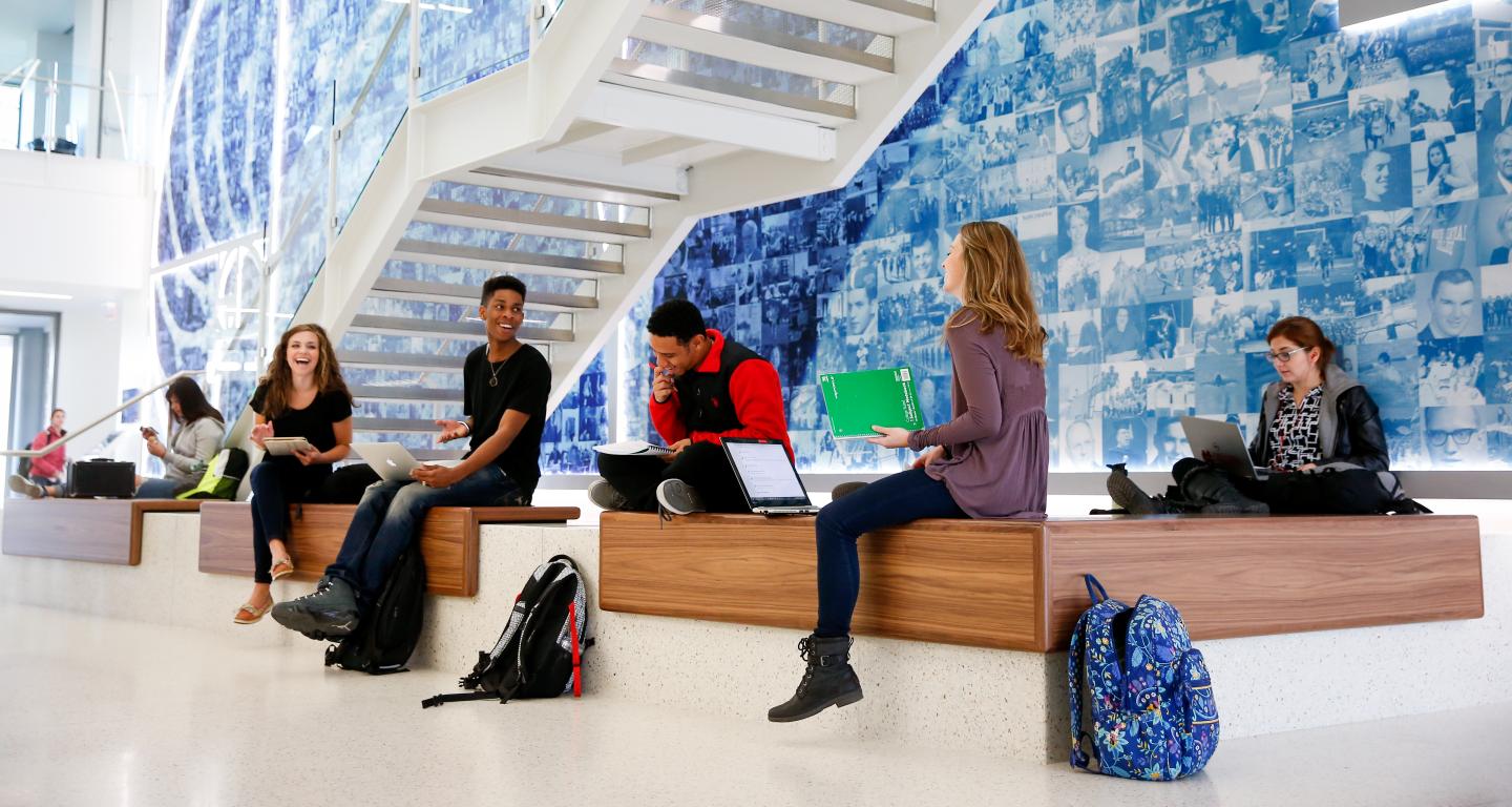 Students sitting in Wentz Science Center Hallway
