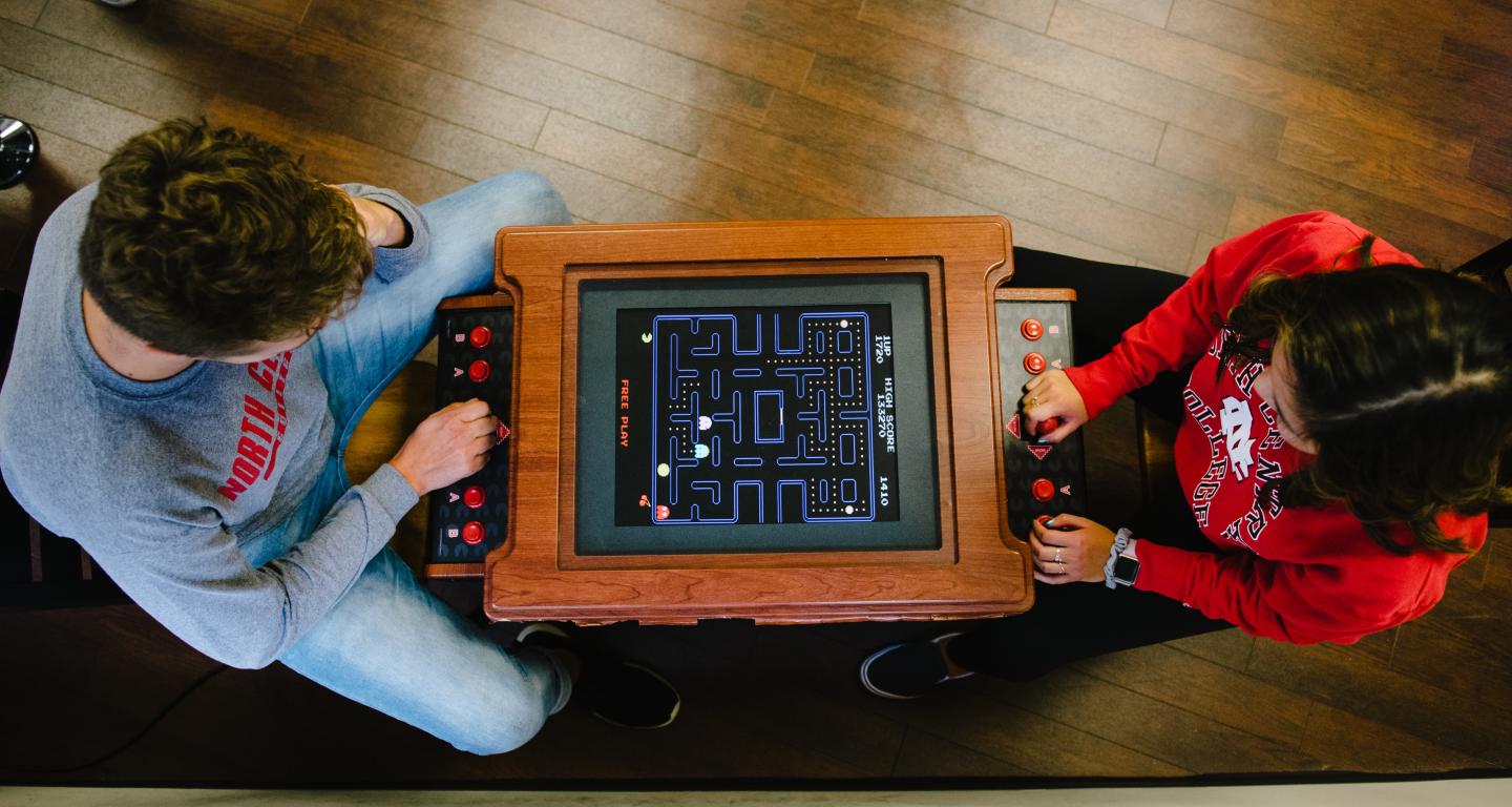 students playing game in lounge