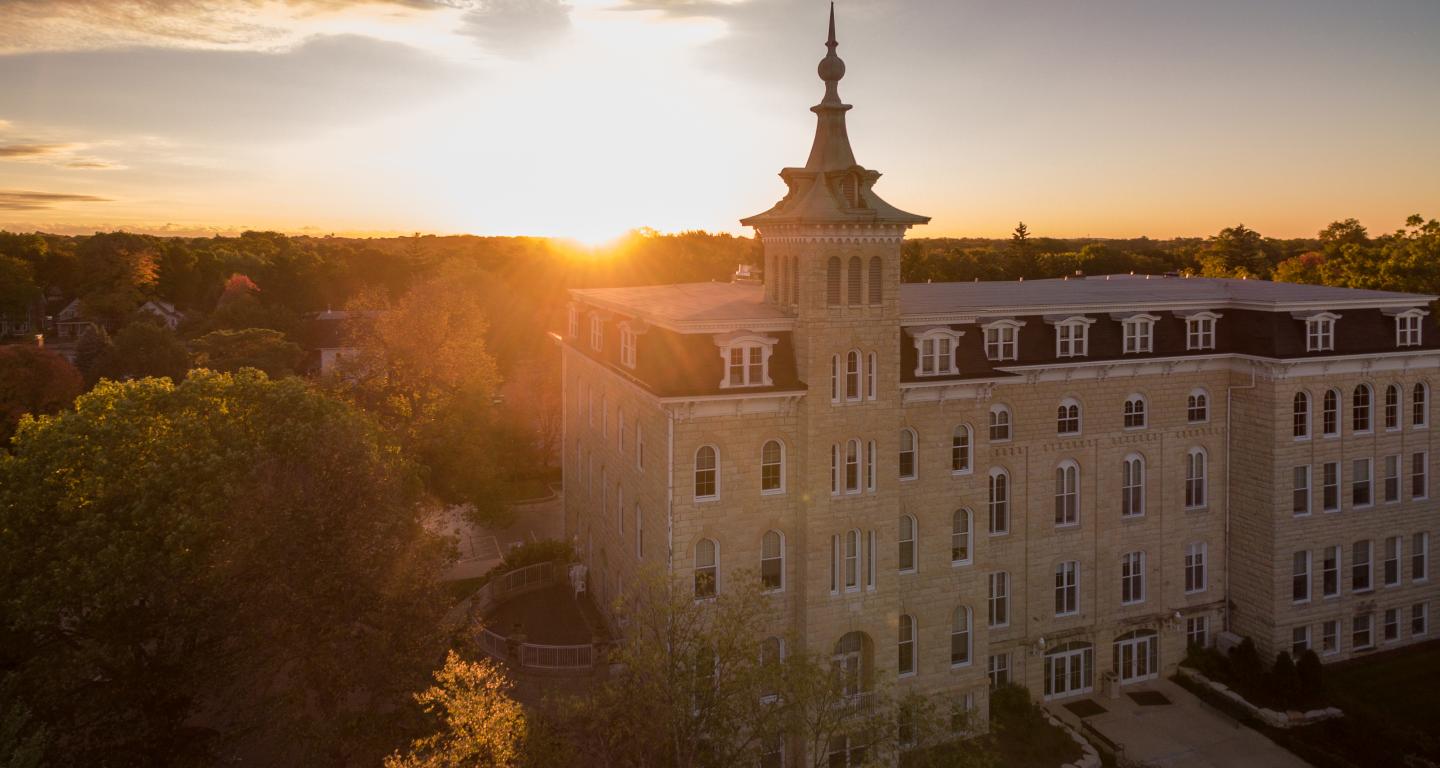 Sunset over North Central College's Old Main with Downtown Naperville in background