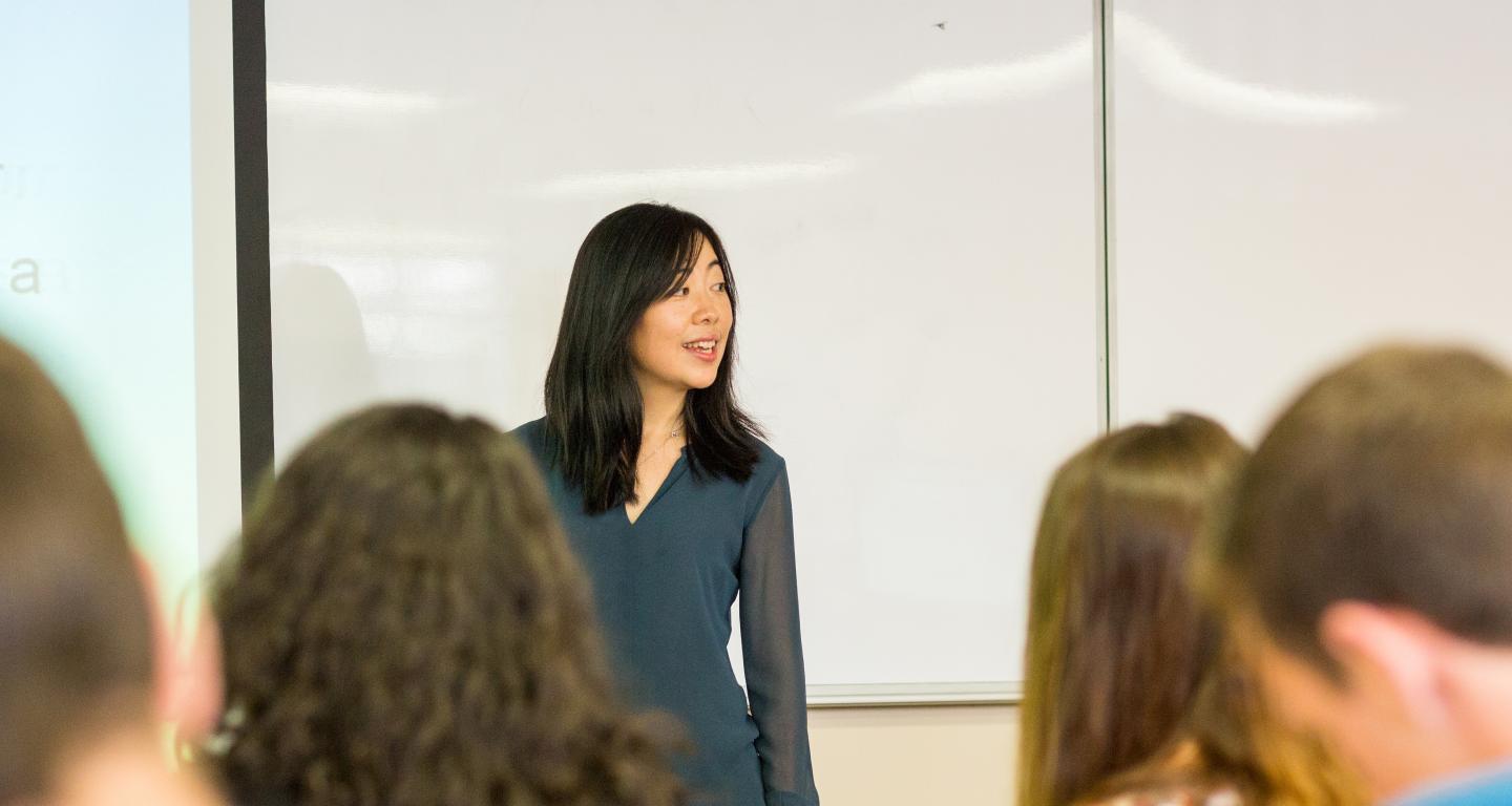 teacher speaking in front of class