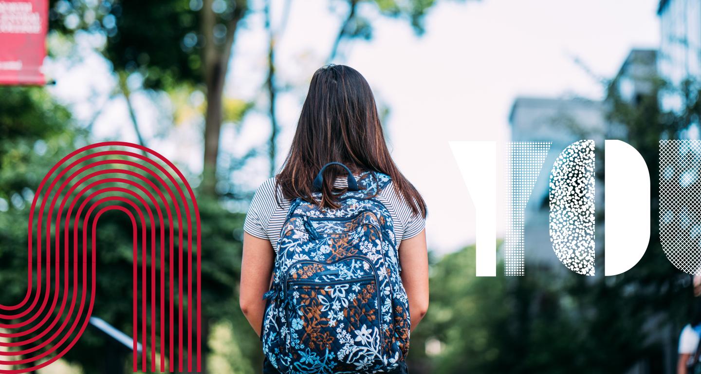 Student walking on path