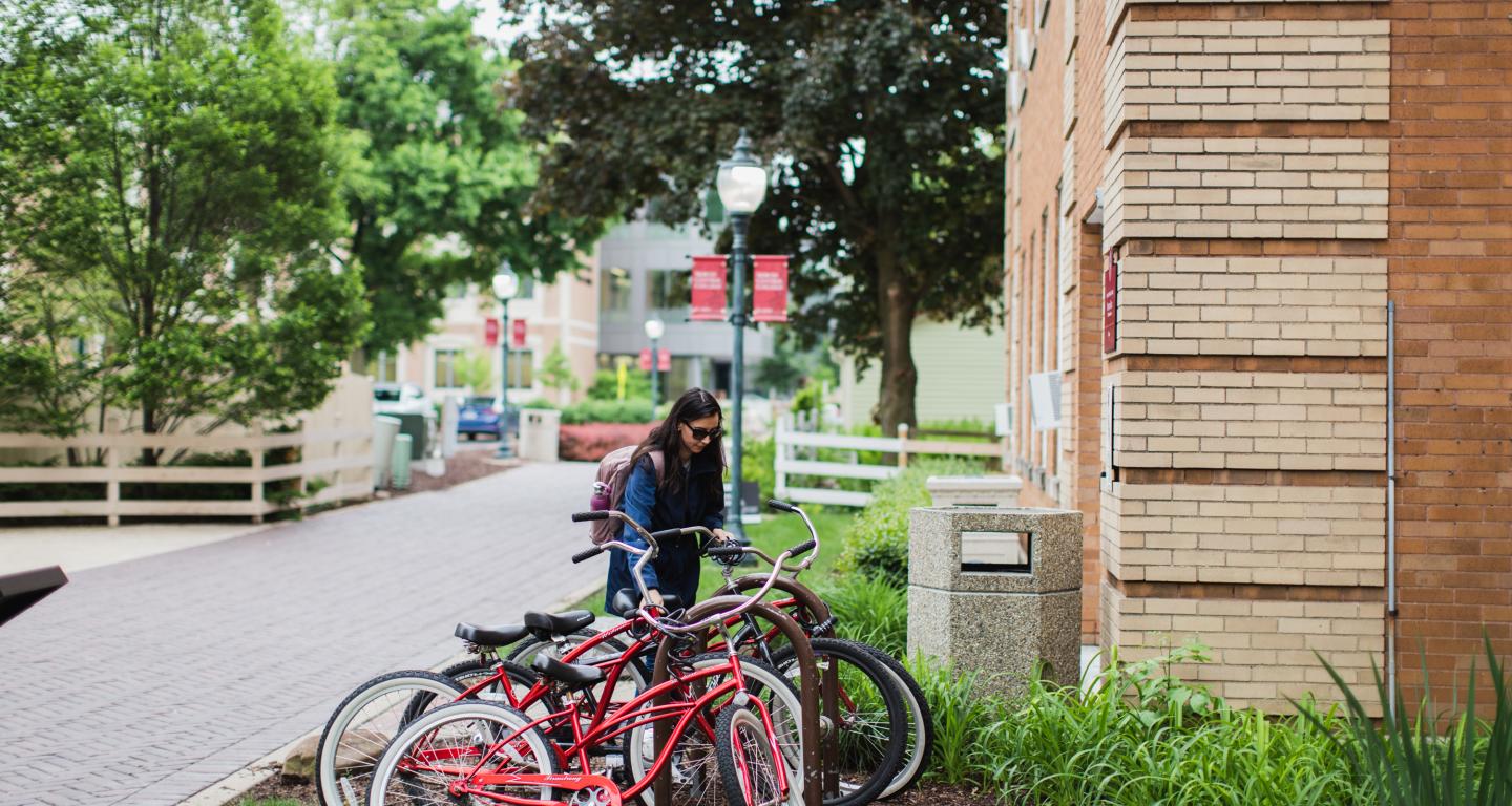 student biking on campus