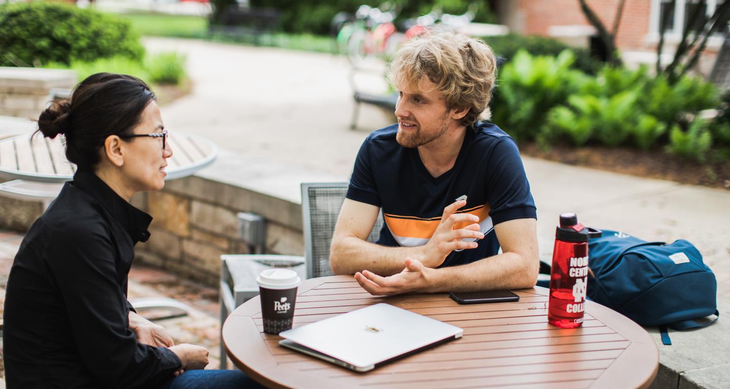 student and professor talking