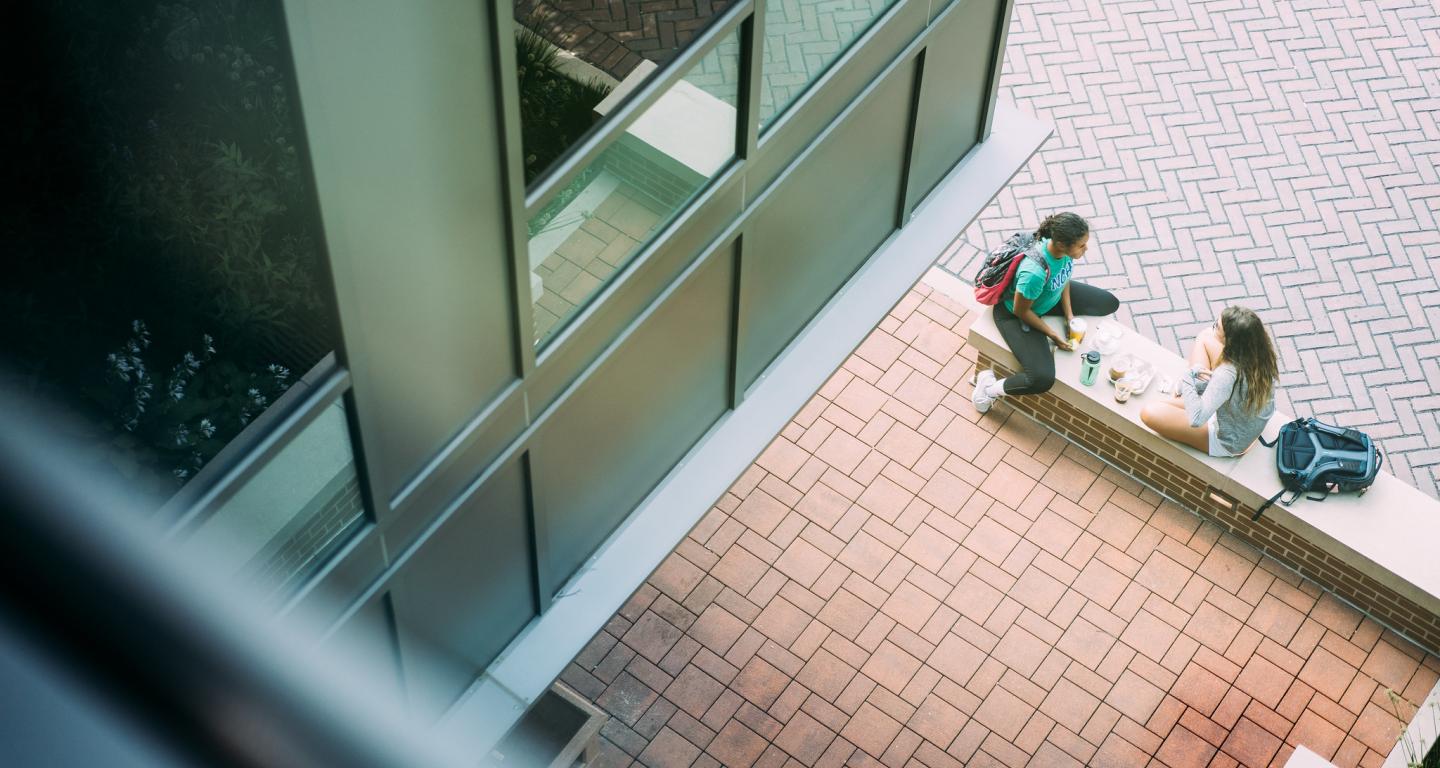 students sitting on campus