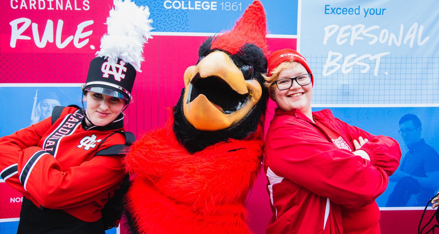 homecoming 2019 chippy the mascot poses with students in front of new branding