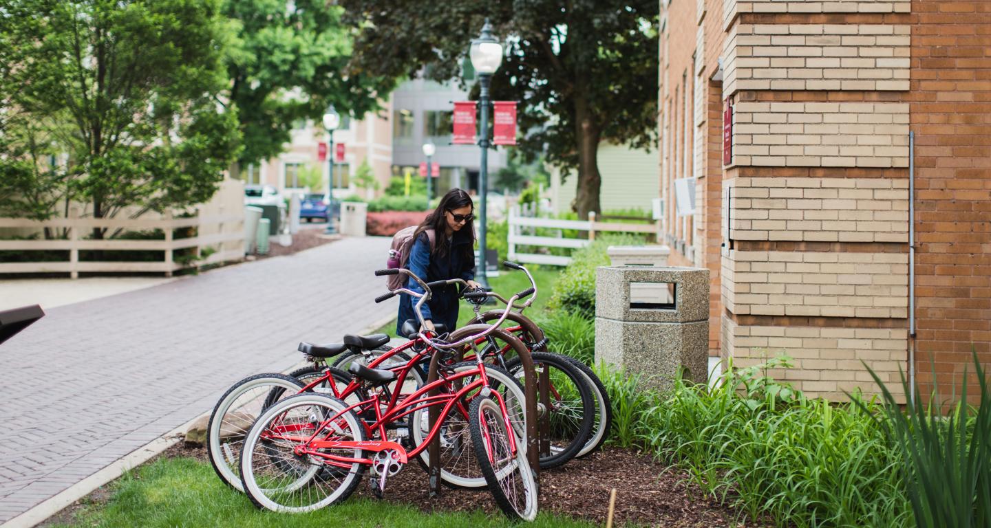 Student biking on campus