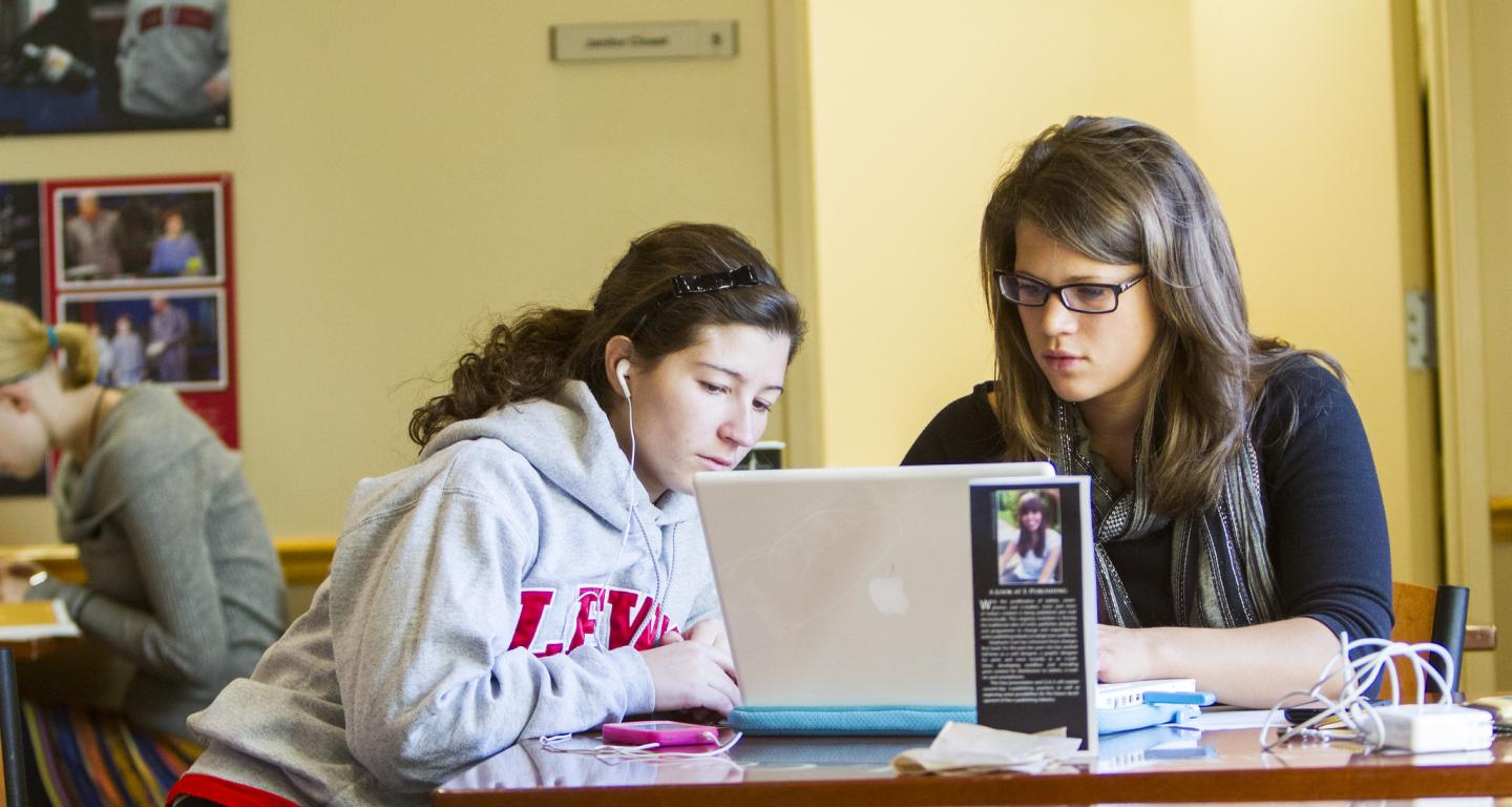 Two students look up how to apply for fafsa