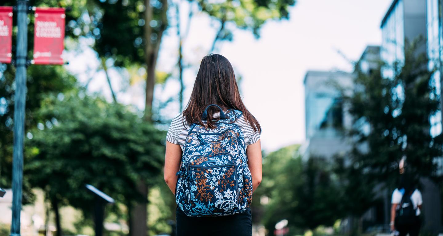 student walking on campus