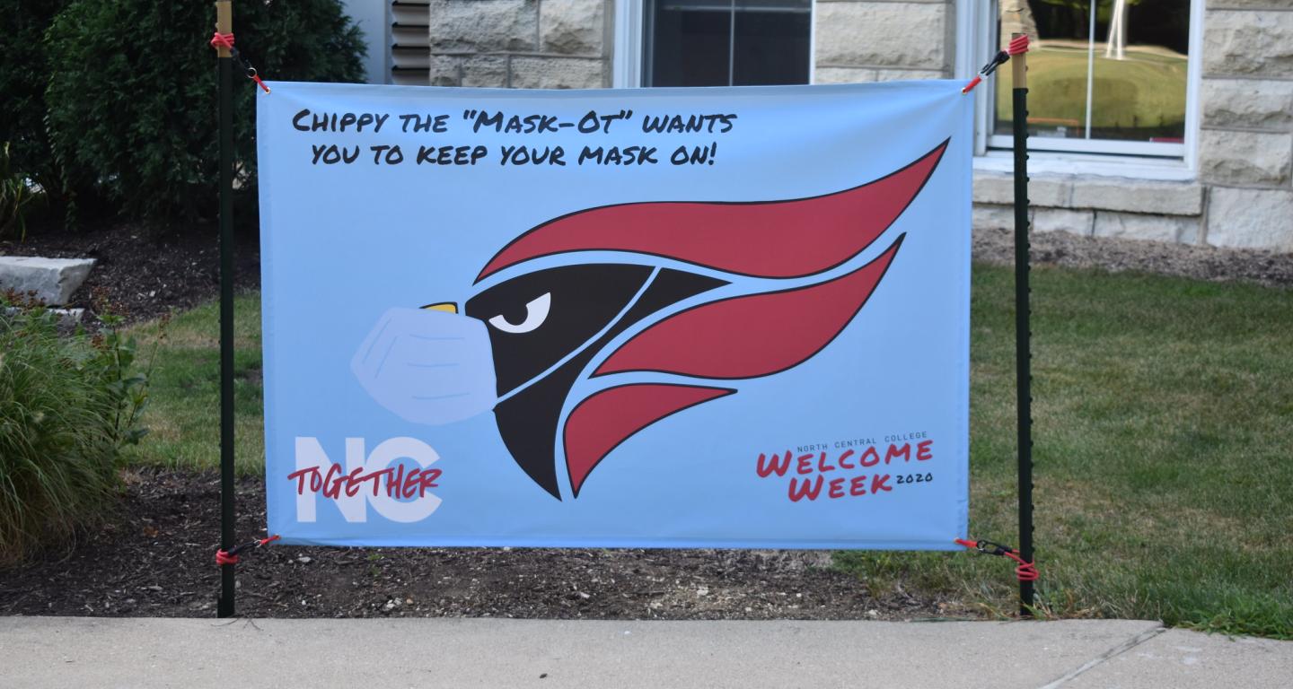 A banner encouraging North Central College students to wear face coverings to protect against COVID-19.