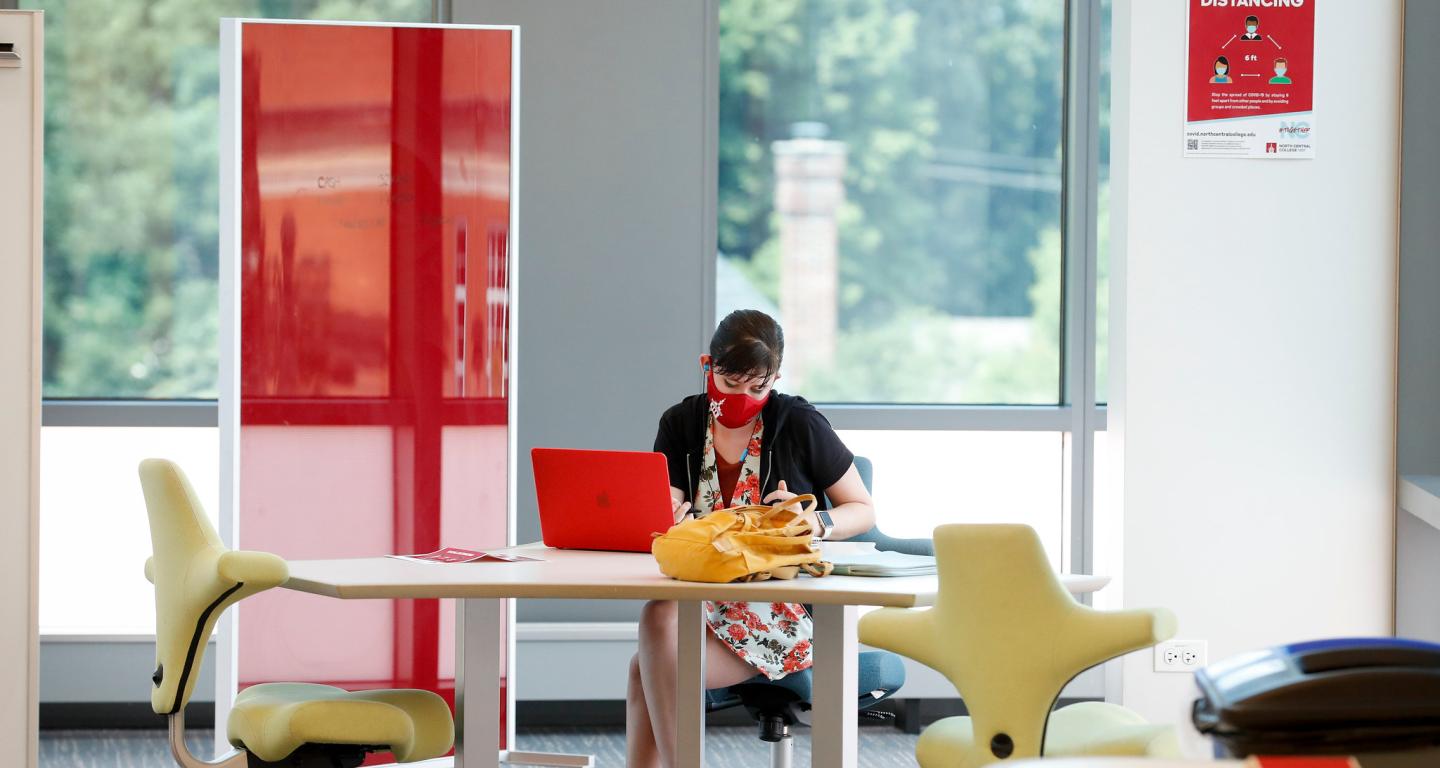 A North Central College student works on their personal website.