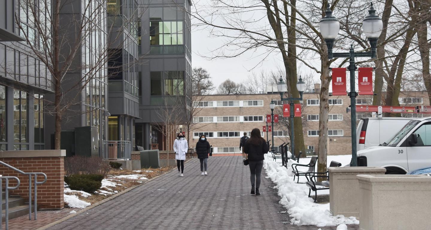 Sociology students walk across the North Central College campus.