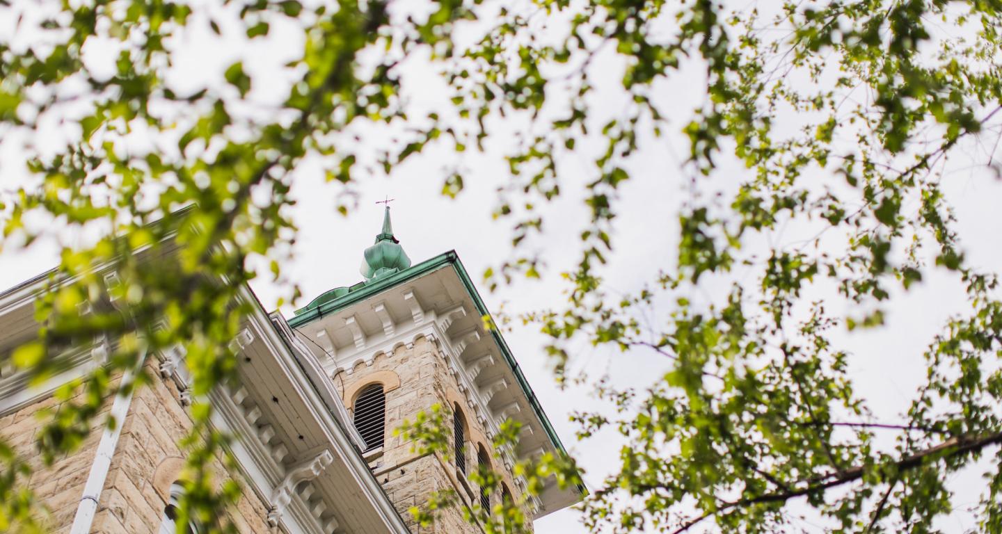 Old Main through tree branches