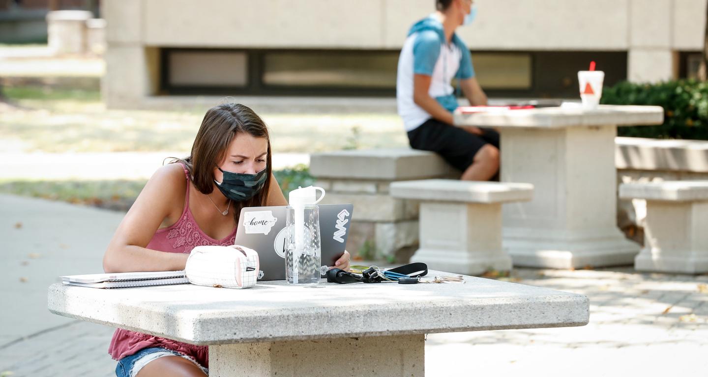 A computer science student working outside at North Central College.