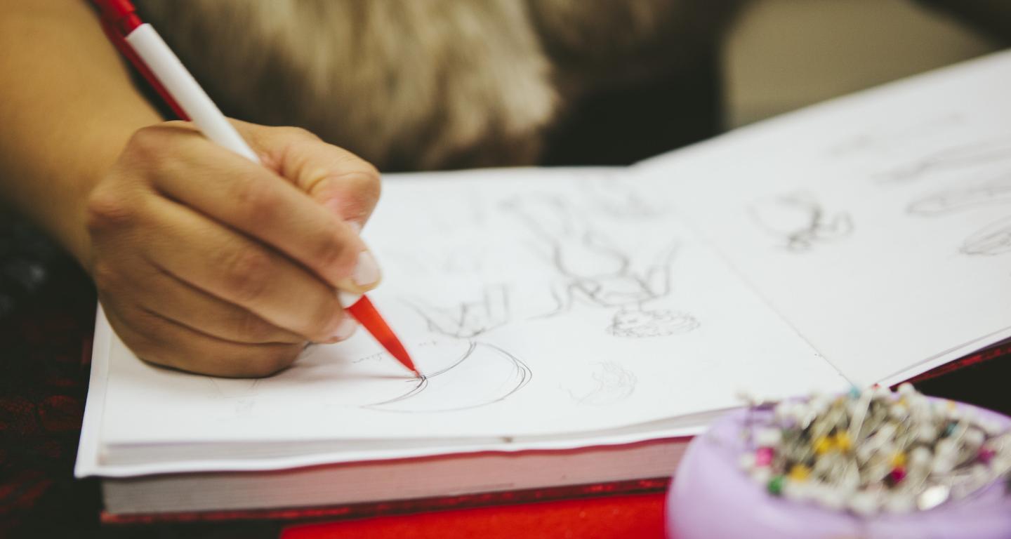 A North Central College graphic design student working on a project.