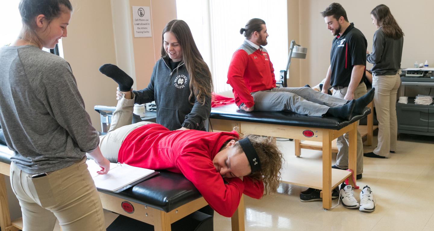 Master's-level athletic training students at North Central College learning the basics.