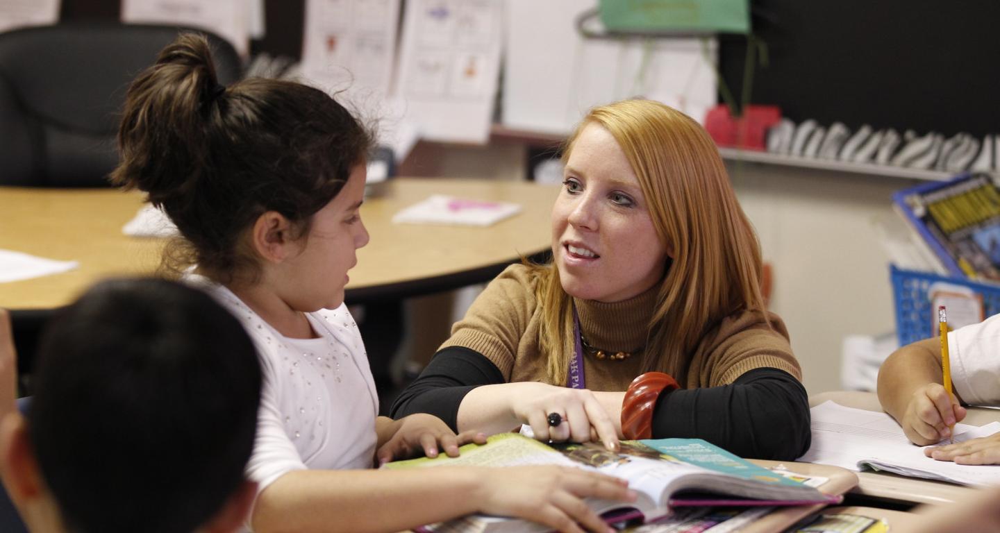 A North Central College music education major works with young students.