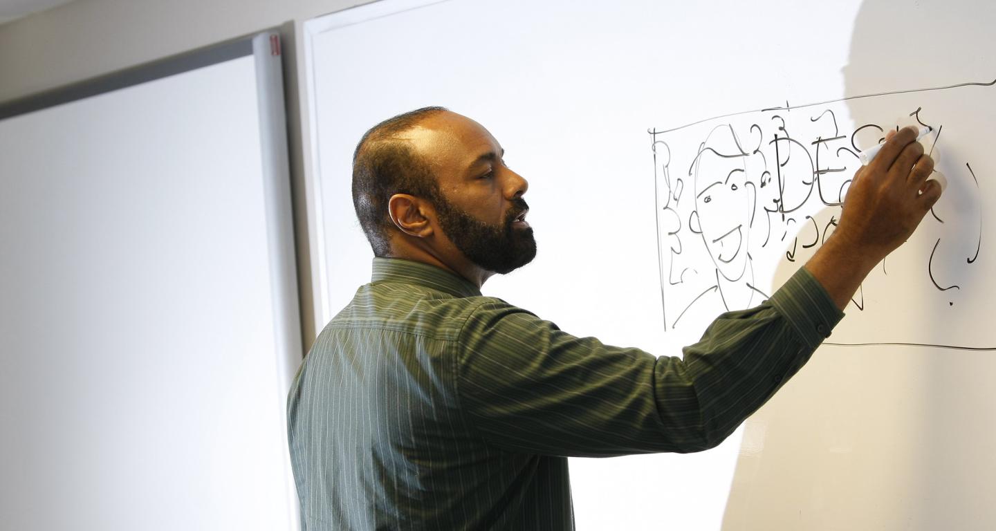 A professor at North Central College teaches a class in actuarial science.