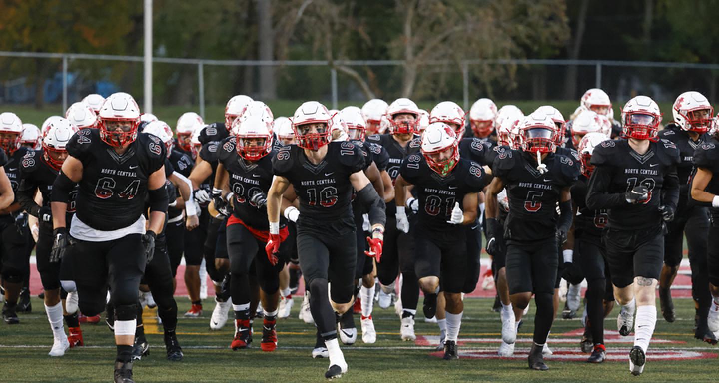 Football team running onto field