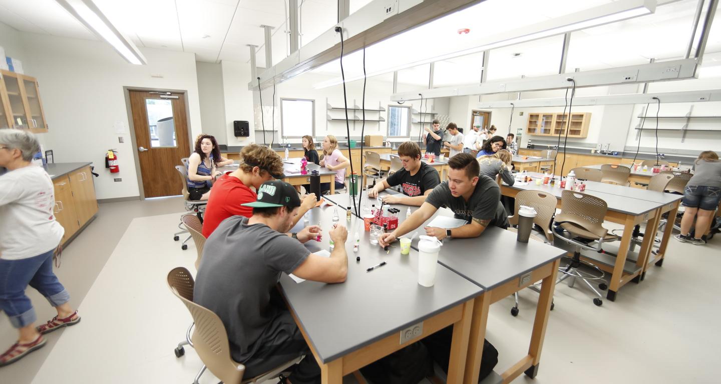 A group of North Central College biology majors work together in the lab.