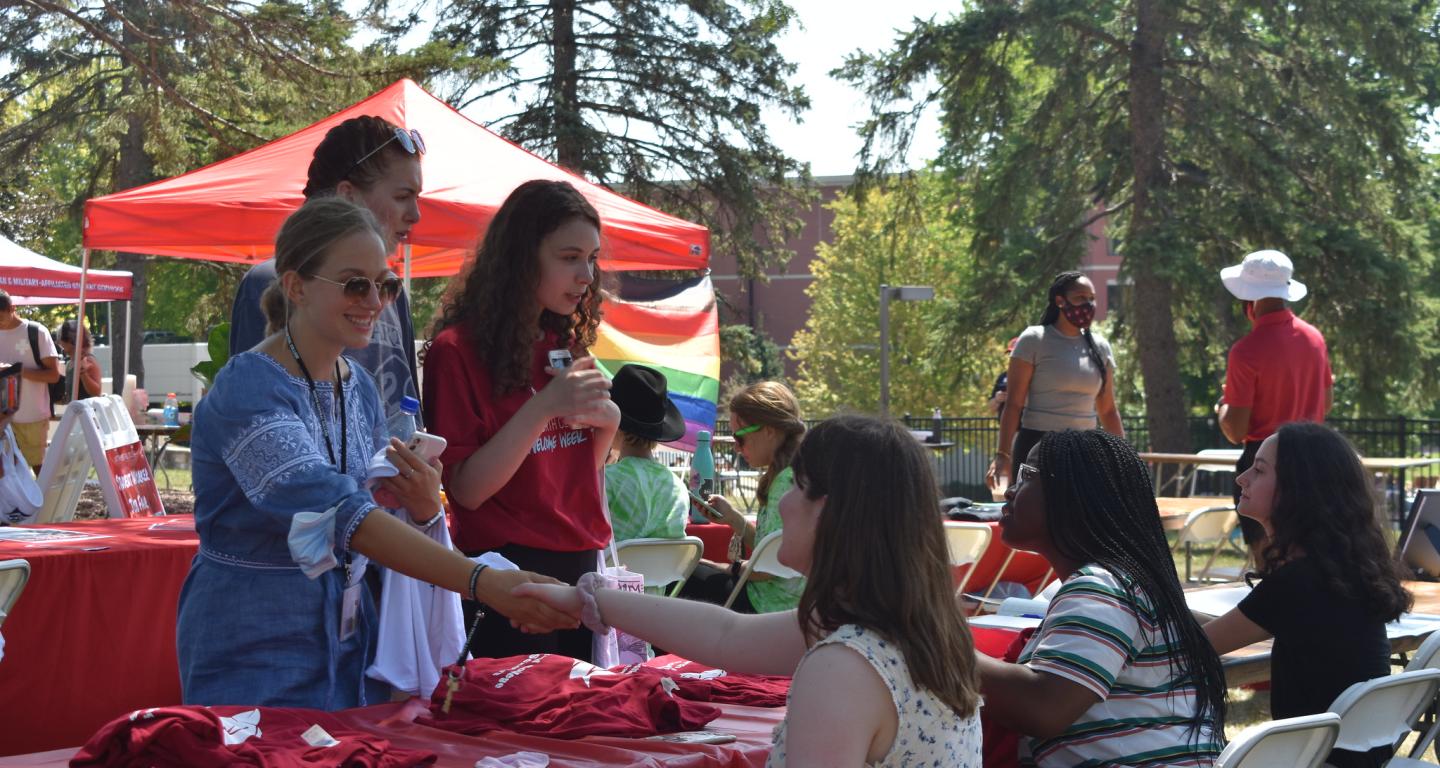 North Central College first-generation students inquiring about resources available to them.