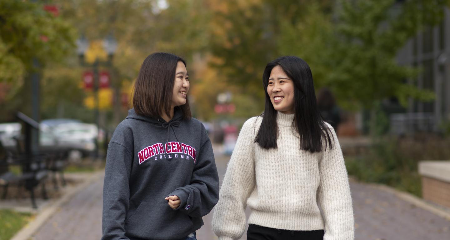 A pair of North Central College students walking on campus.