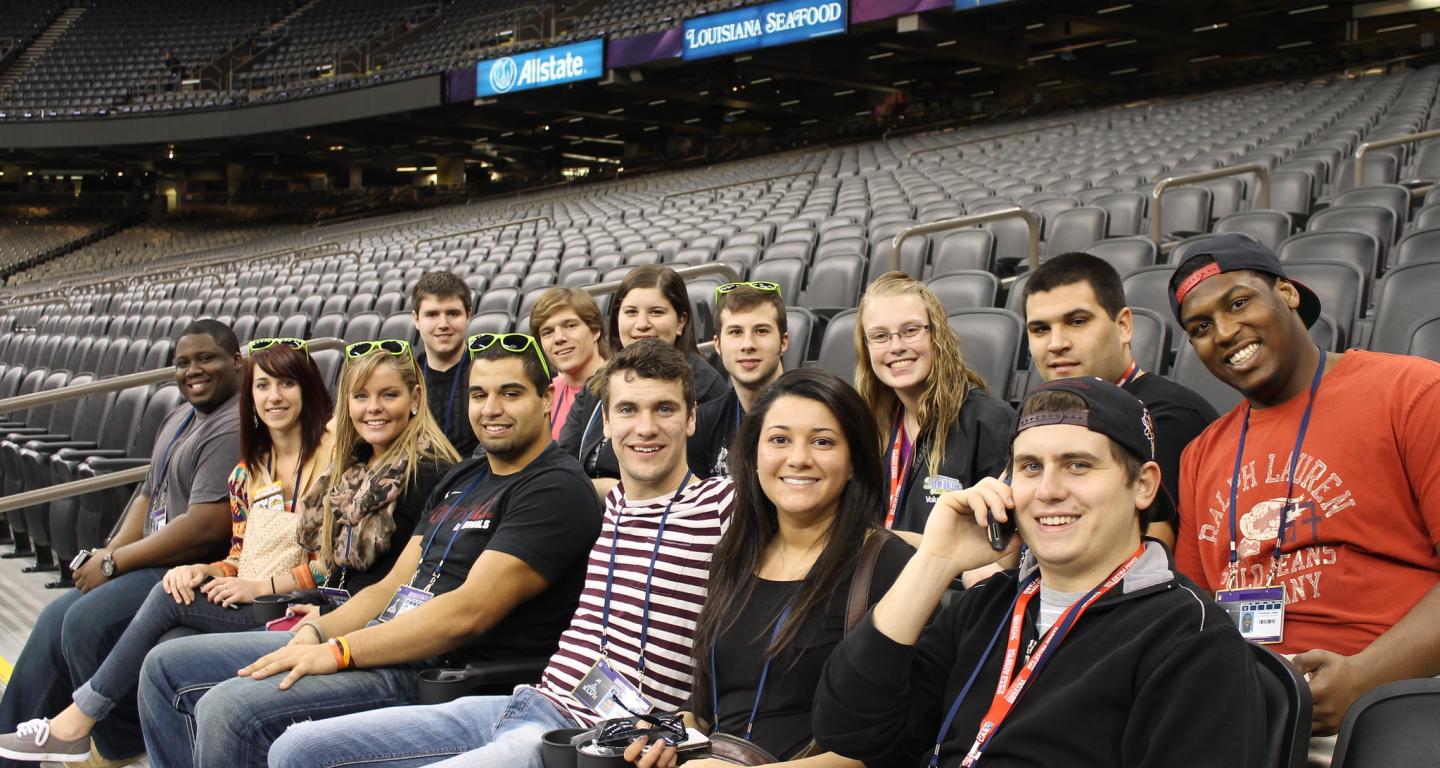 North Central College sport management students getting a tour of an arena.