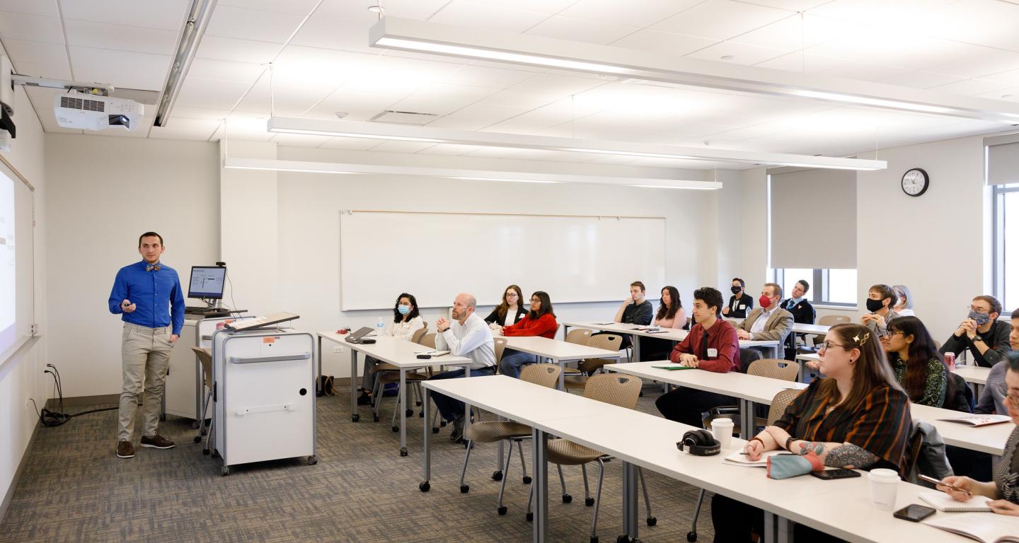 A North Central College economics students presents to his class.