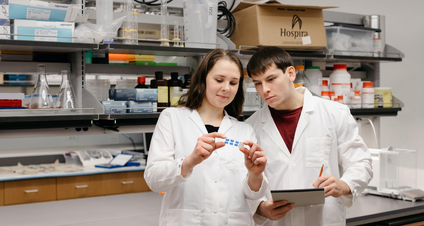 Neuroscience students at North Central College studying samples in the lab.