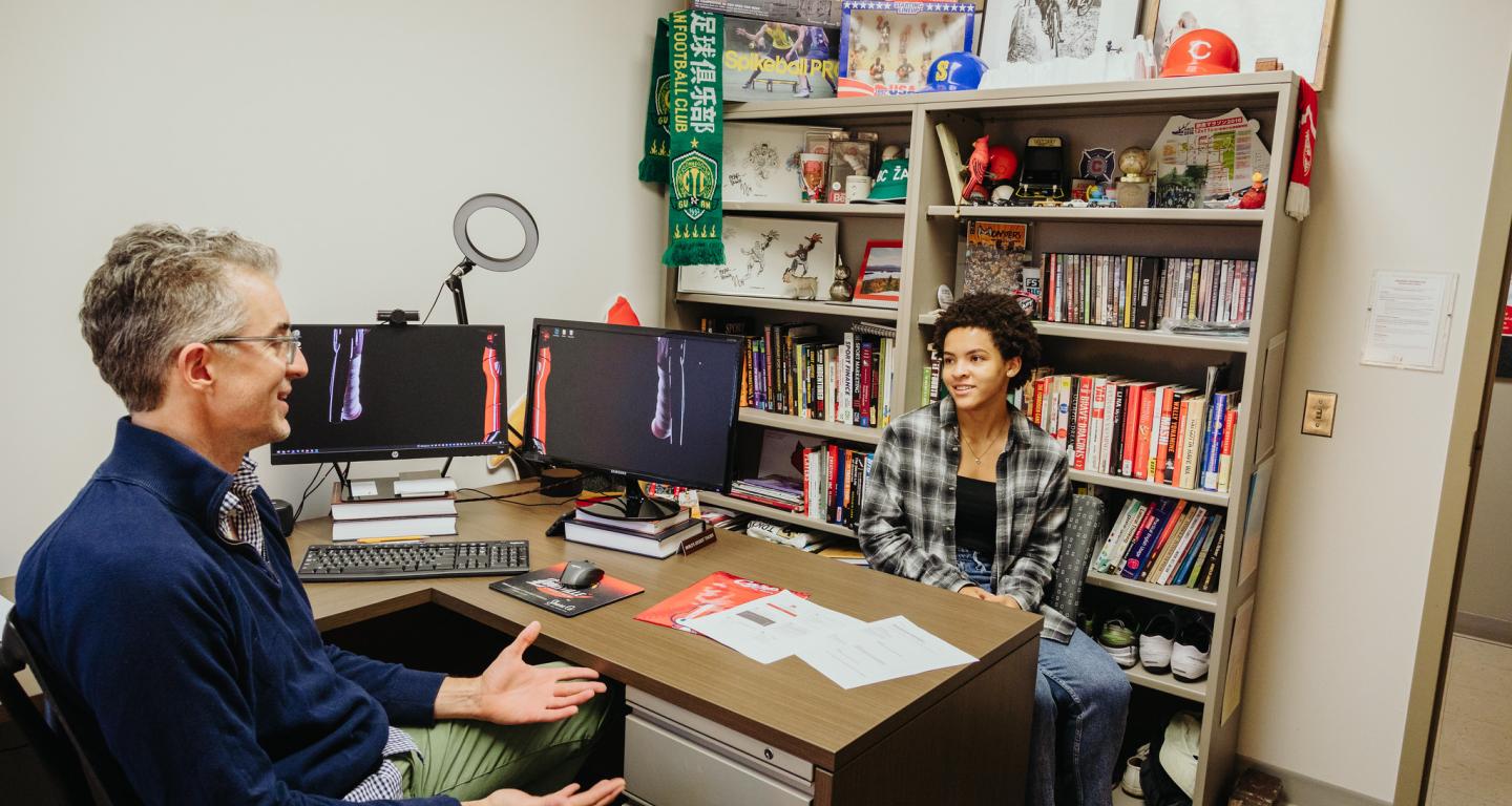 A North Central College sociology student works with a professor.