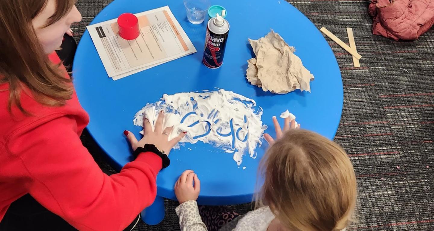 North Central College master of occupational therapy students work with children on their handwriting.