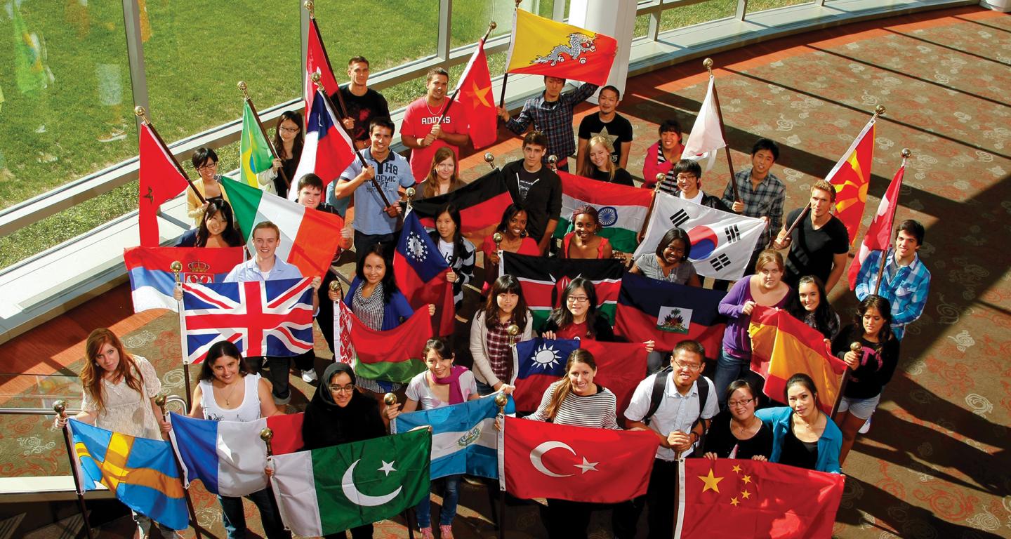 North Central College students hold the flags of their many home countries.