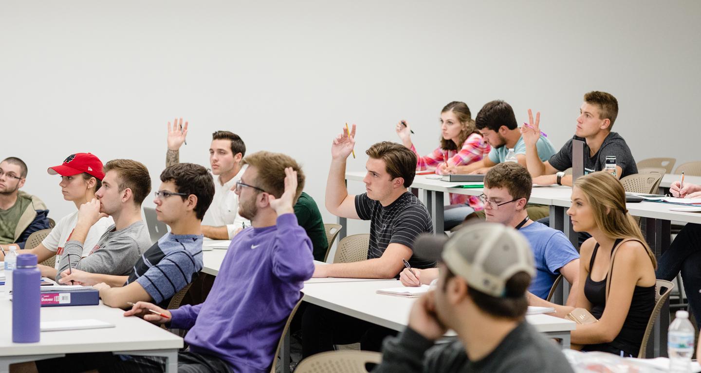 North Central College philosophy students taking a class.