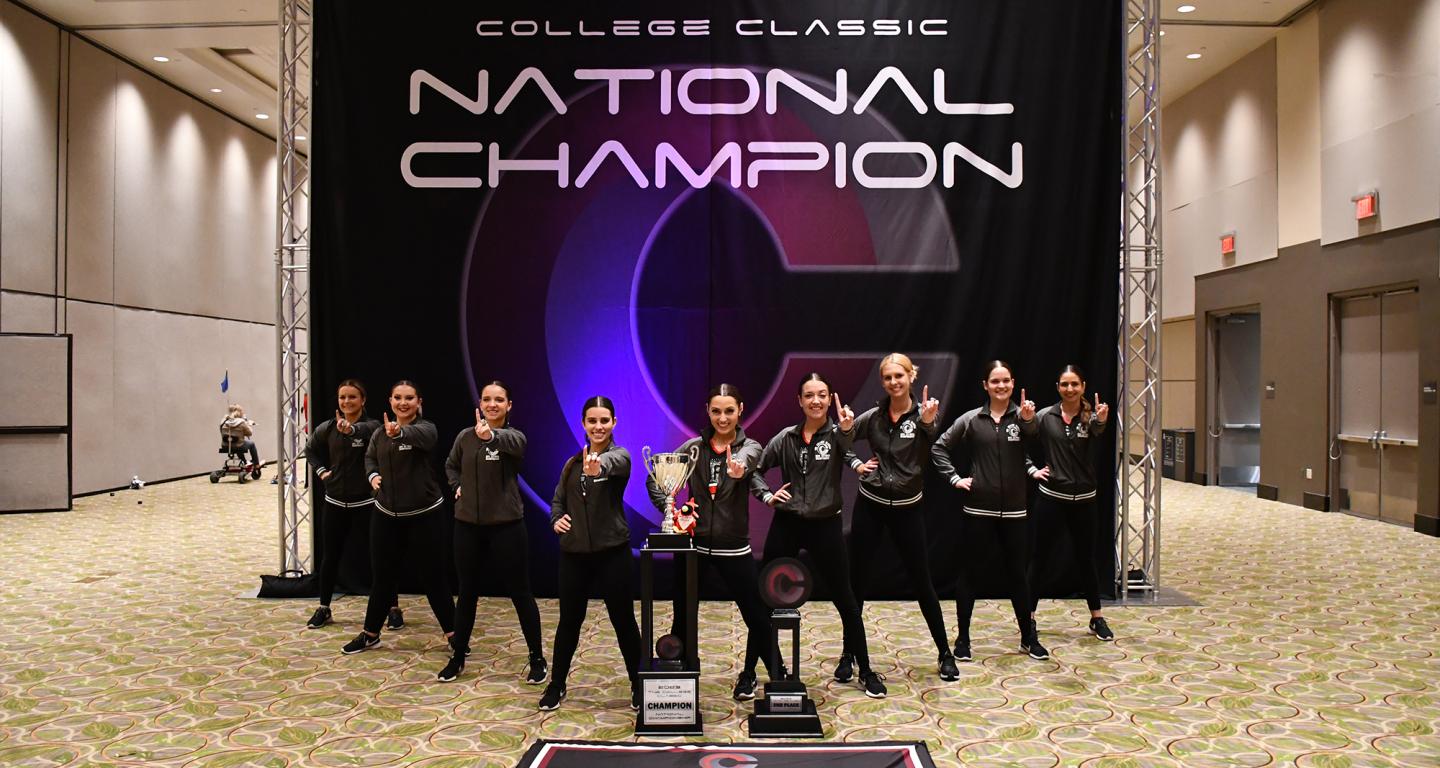 The North Central College dance team with their championship trophy.