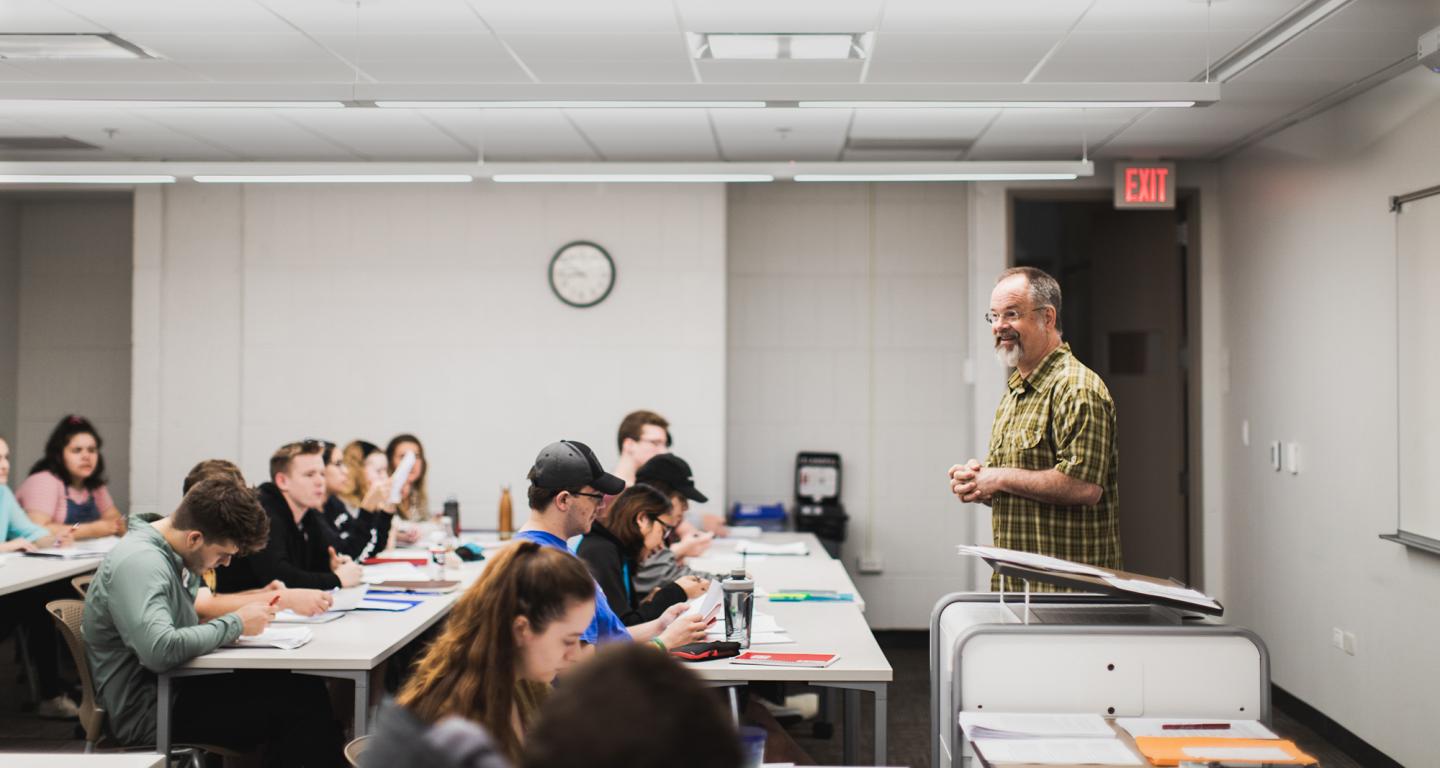 North Central College students listening to a professor in an ethical leadership class.