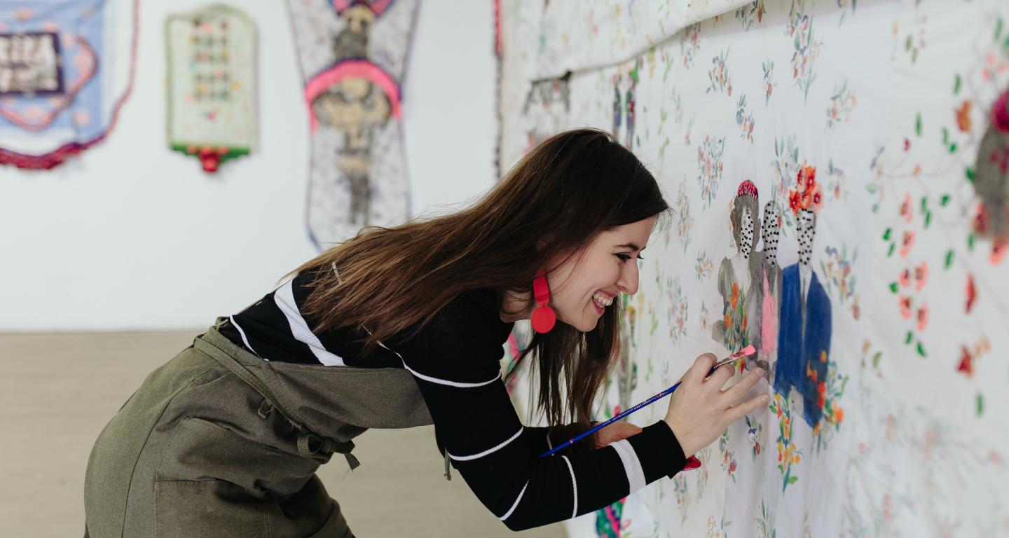 A North Central College studio art student with her collage.