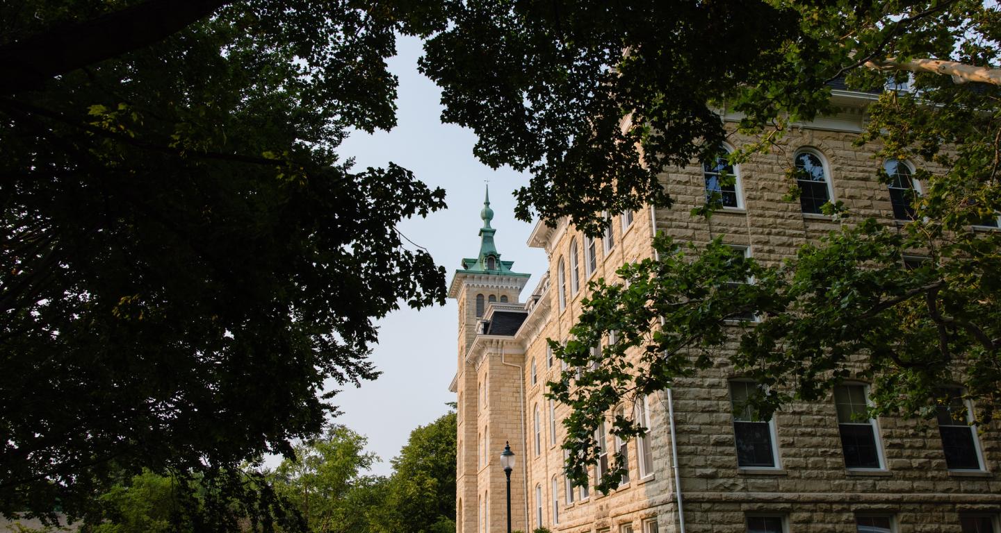 A photo of Old Main during the summer.