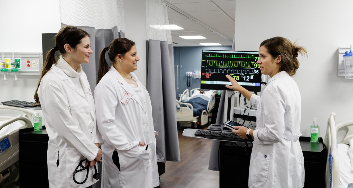 Nursing students and professor in North Central College's Nursing Skills Lab