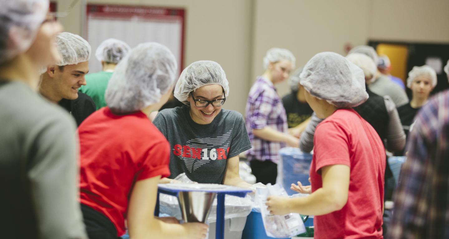 Students working at a Feed the Need event.