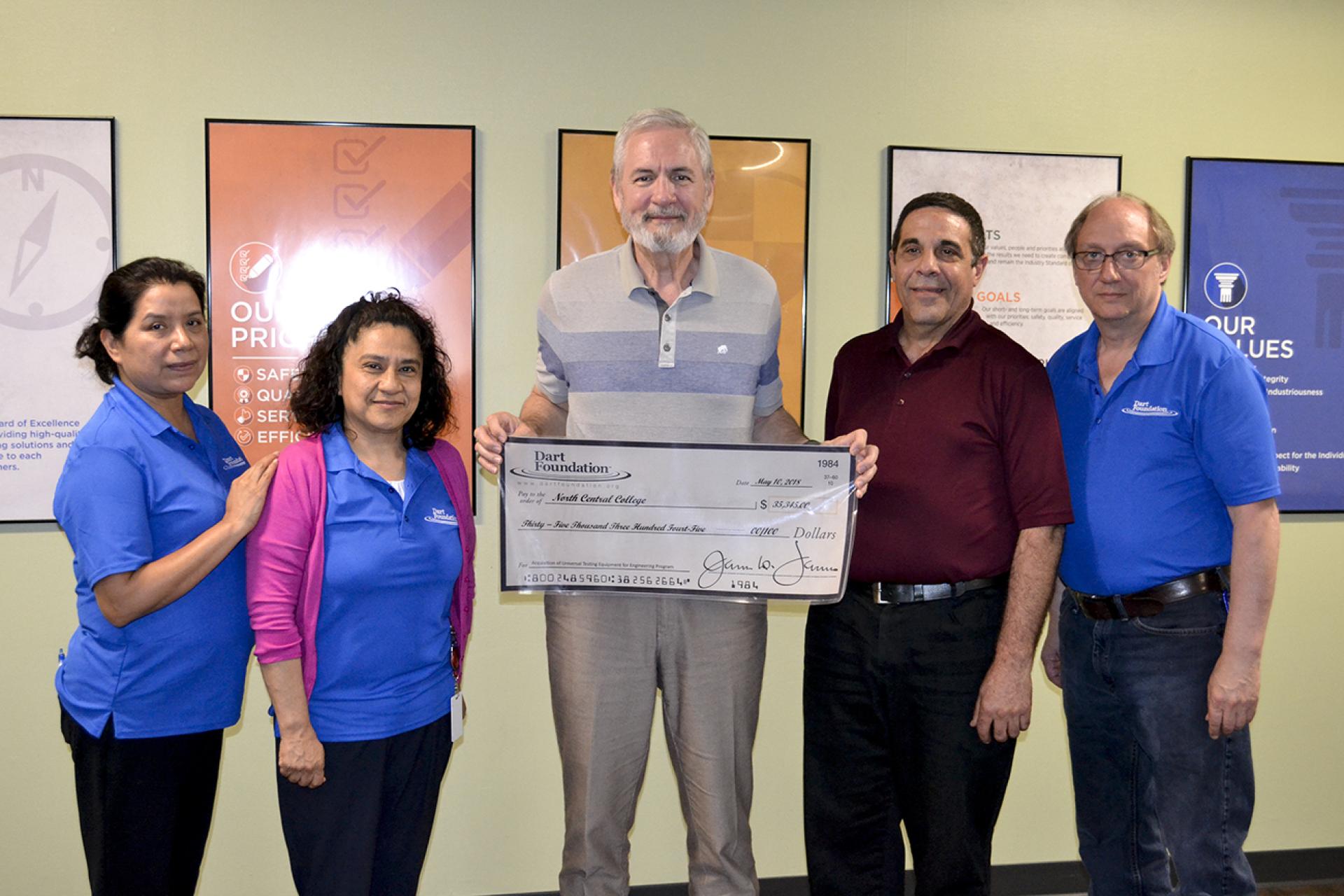 North Central's Frank Harwath, director of the engineering program and professor of engineering, accepts grant check from Dart Foundation